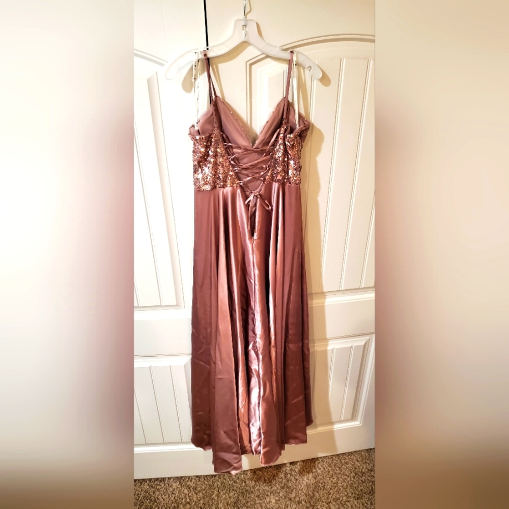 A Jules and cleo formal dress with a lace up back and gorgeous v-line .size:10